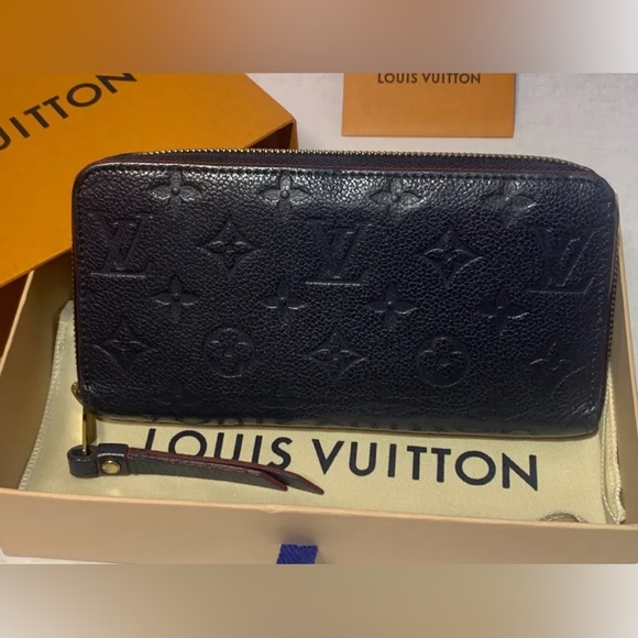 Louis Vuitton Handbags - Louis Vuitton Clémence Wallet Monogram Zippy Black with red interior.